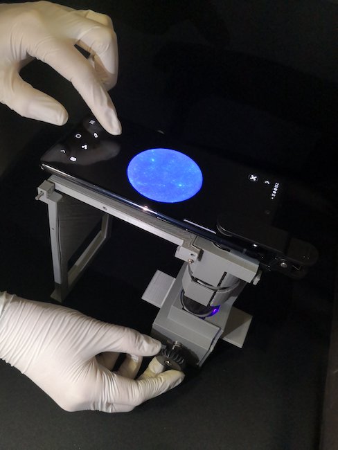 UArizona researchers image a sample using a smartphone microscope. Credit: UArizona Biosensors Lab